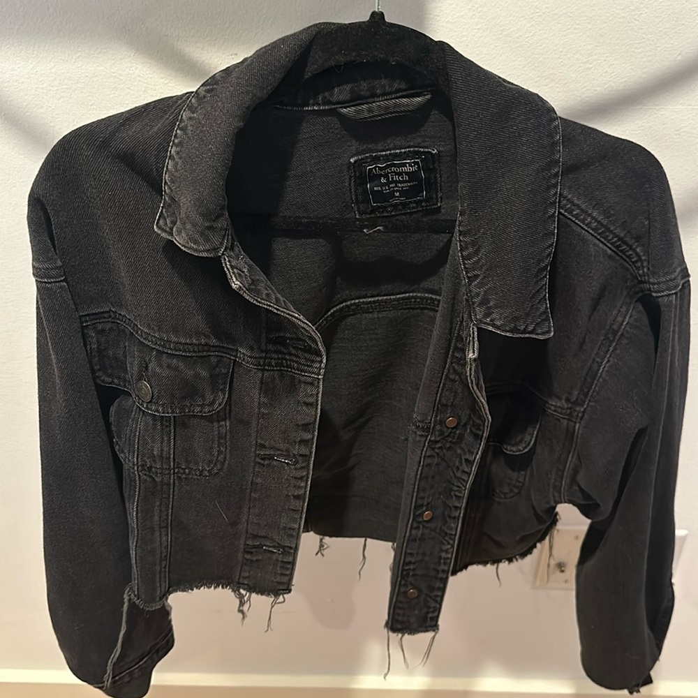 Black frayed crop jacket.